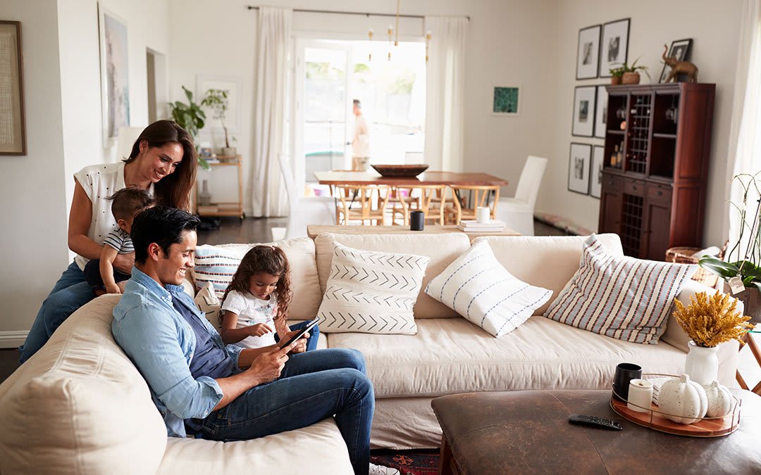 Happy family at home in a light and bright living room