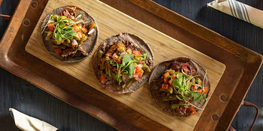 Carnitas tacos on fresh, hand made tortillas at Calavera