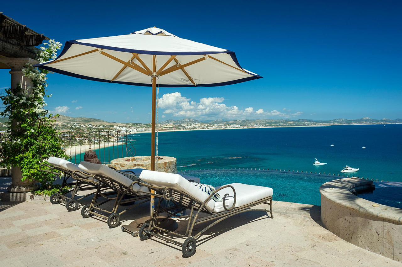 View of the ocean from the sun chairs on the balcony of a vacation rental property for sale in Palmilla, San José del Cabo