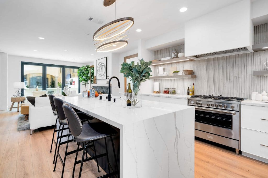 Modern luxurious open concept kitchen with waterfall island