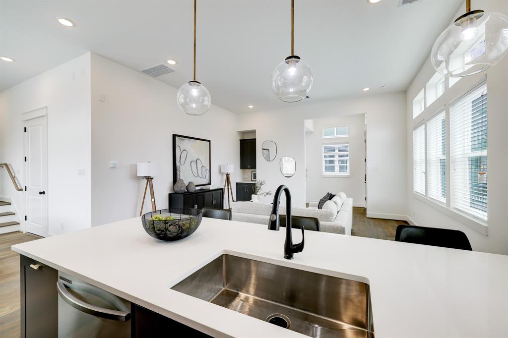 close up image of a model kitchen's large sink 