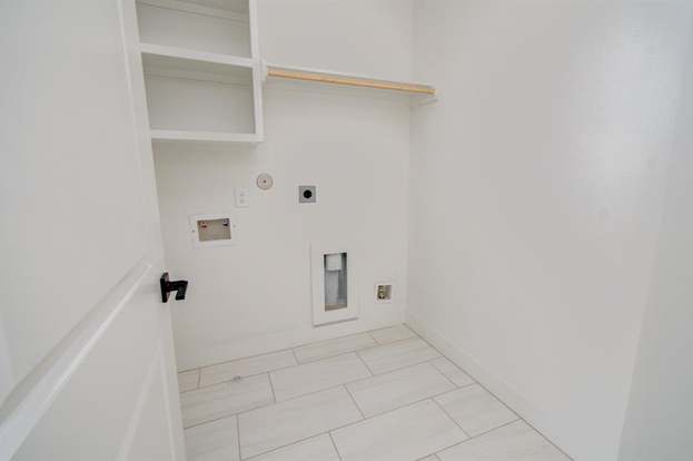 laundry room with storage 