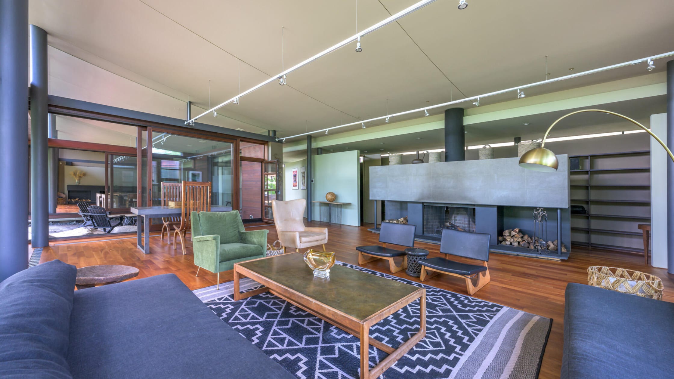 living space with a large concrete fireplace - stone house properties - 250 Long Pond Road