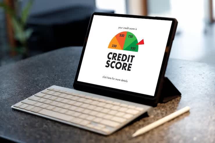 a tablet showing a credit score