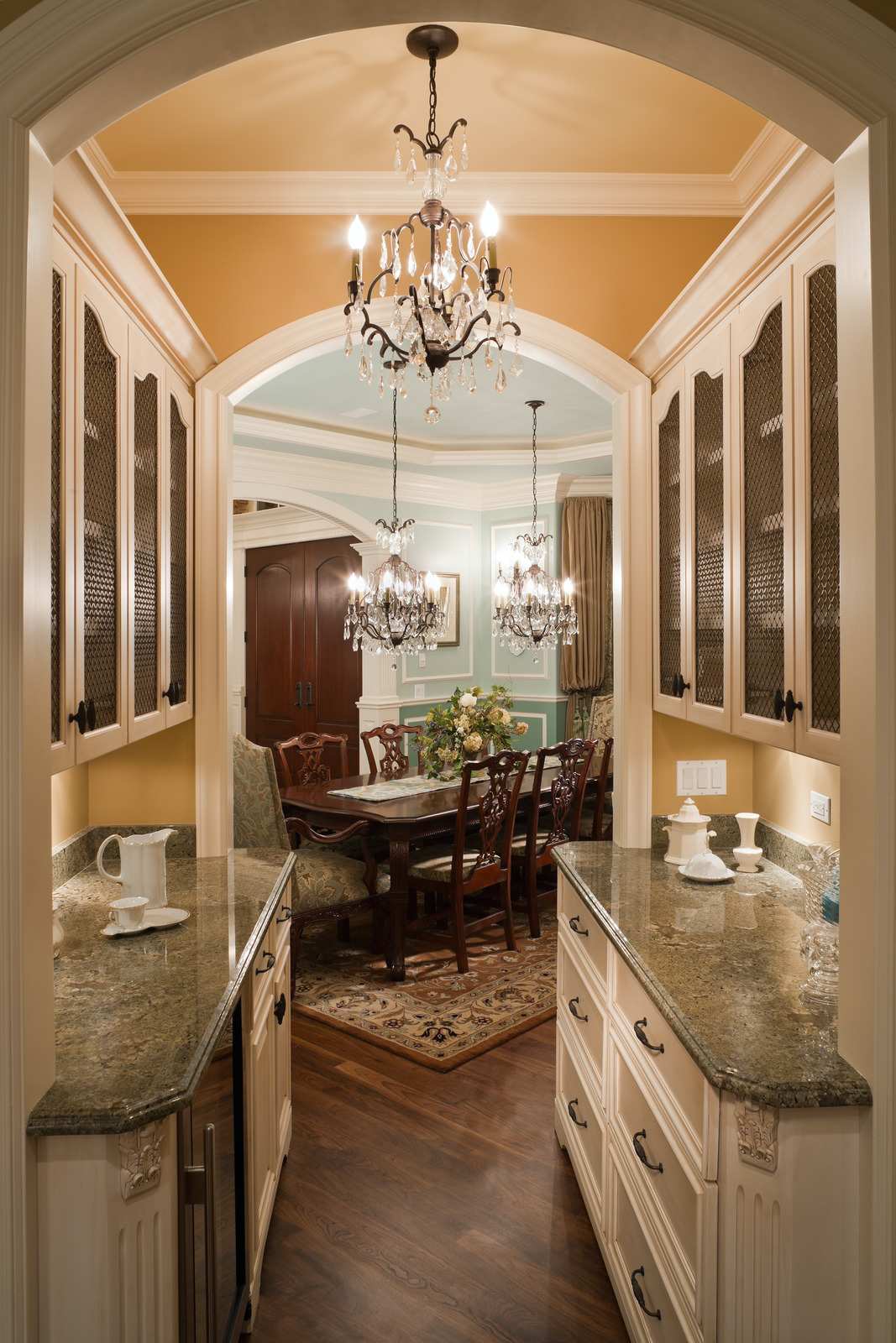 elegant butler pantry leading to formal dining room