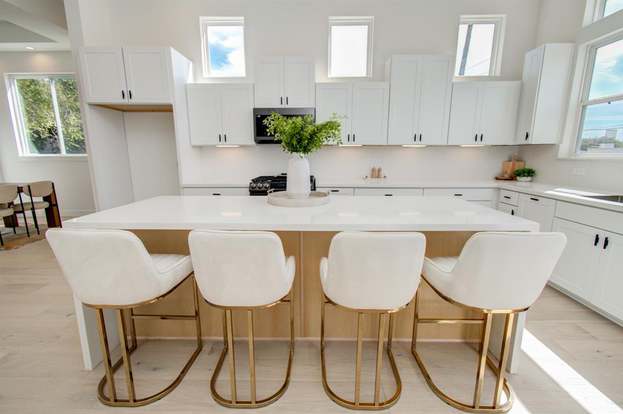 large kitchen with a breakfast bar