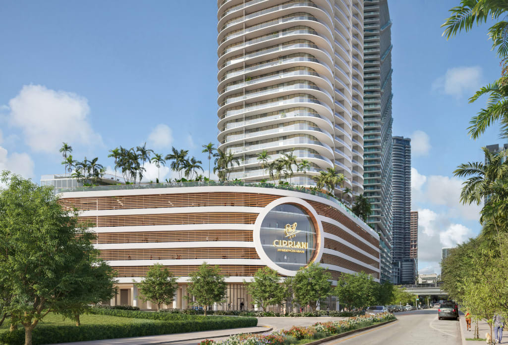 Cipriani Residences tower with rounded balconies above a landscaped podium.
