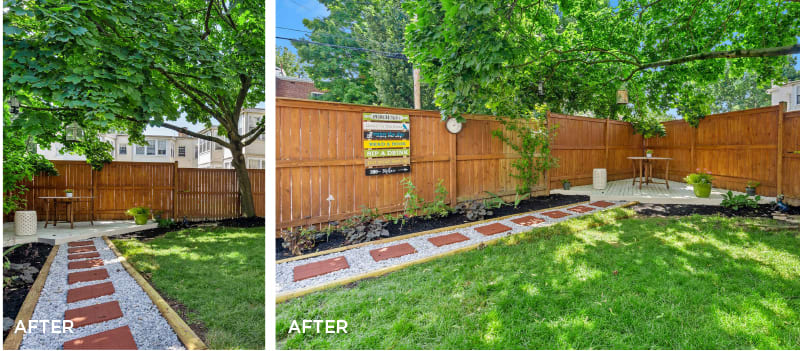 Landscaped backyard with a paver path, green lawn, mature trees, and a tall wooden privacy fence.