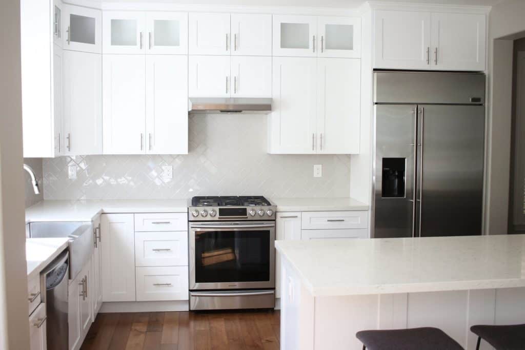 Before kitchen with brown cabinets and ceramic tile