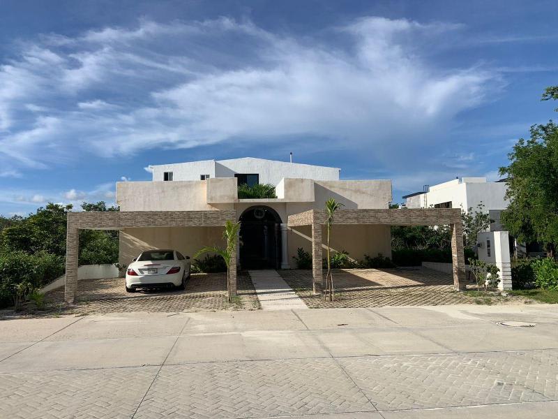 House Can-Can, a captivating residence nestled within the prestigious Cancun Country Club front