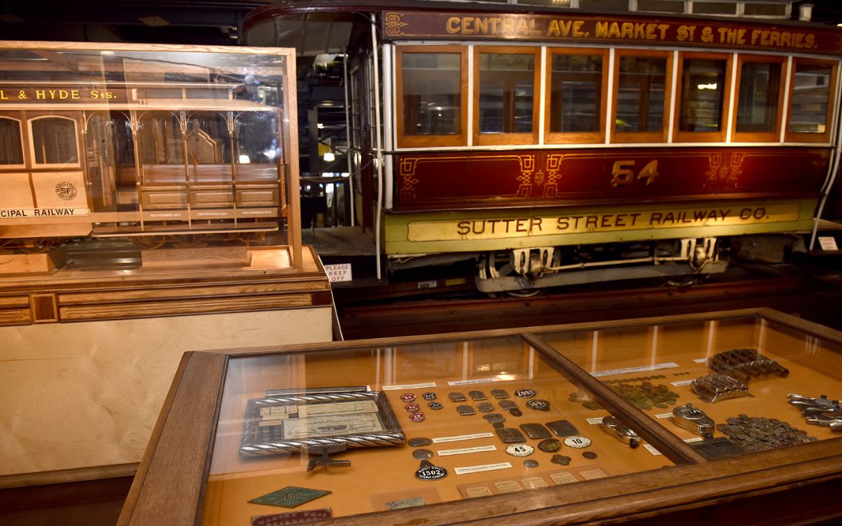 Interior view of San Francisco Cable Car Museum with various historical exhibits on display