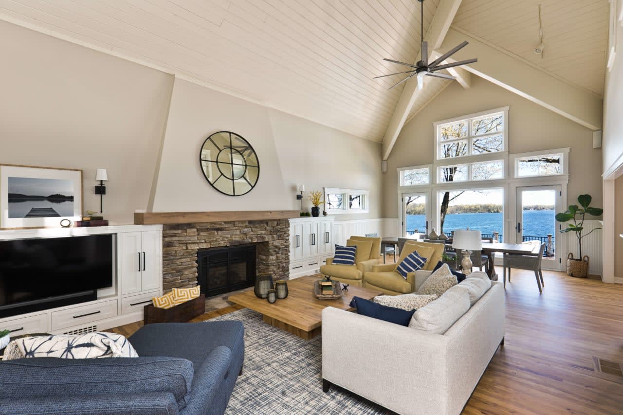 Inviting and cozy living room with warm colors and a fireplace.