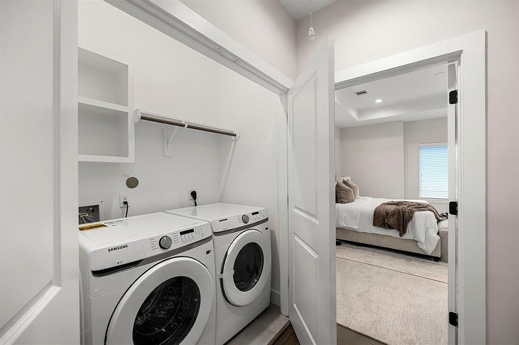 laundry room next to a bedroom