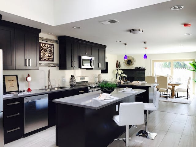 Large modern kitchen with an island as one of the top amenities for your Miami home.