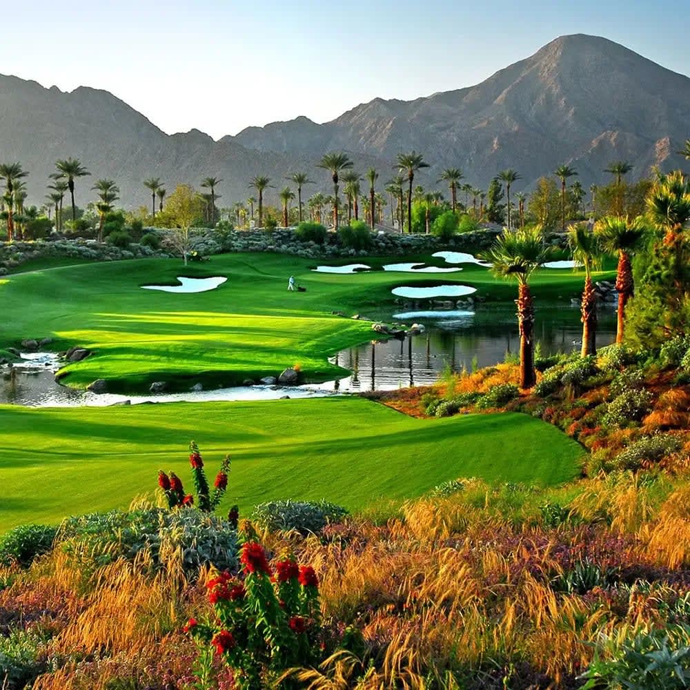 Lush green golf course in Palm Springs with stunning mountain views. Imagine living in this desert oasis.