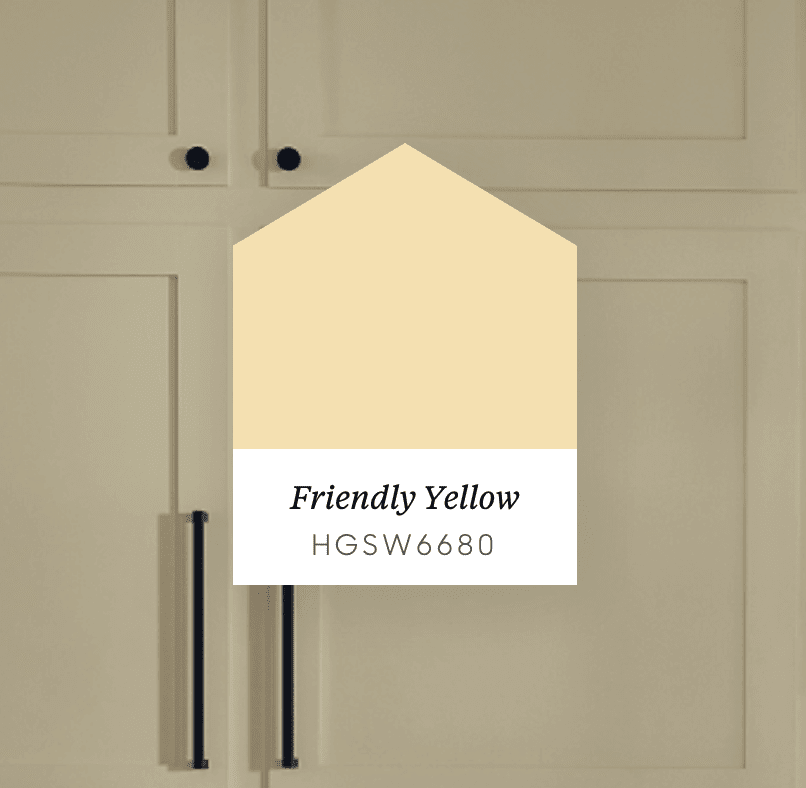 Friendly Yellow paint swatch labeled HGSW6680 over beige kitchen cabinets.