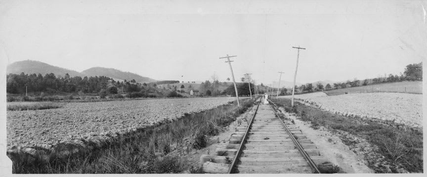 A trolley service ran through Baird Bottom carrying vacationers back and forth between a transfer station near Grace Church on Merrimon Avenue and Weaverville. 