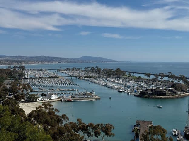 Dana Point Harbor overview with boats docked and surrounding landscape.