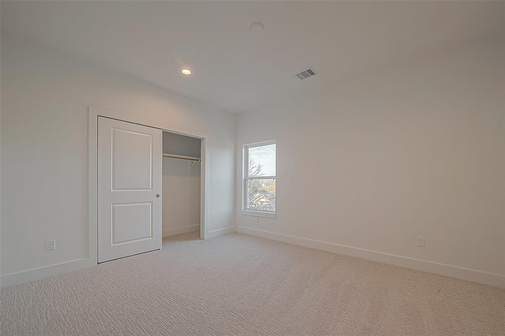 carpeted bedroom with a closet 