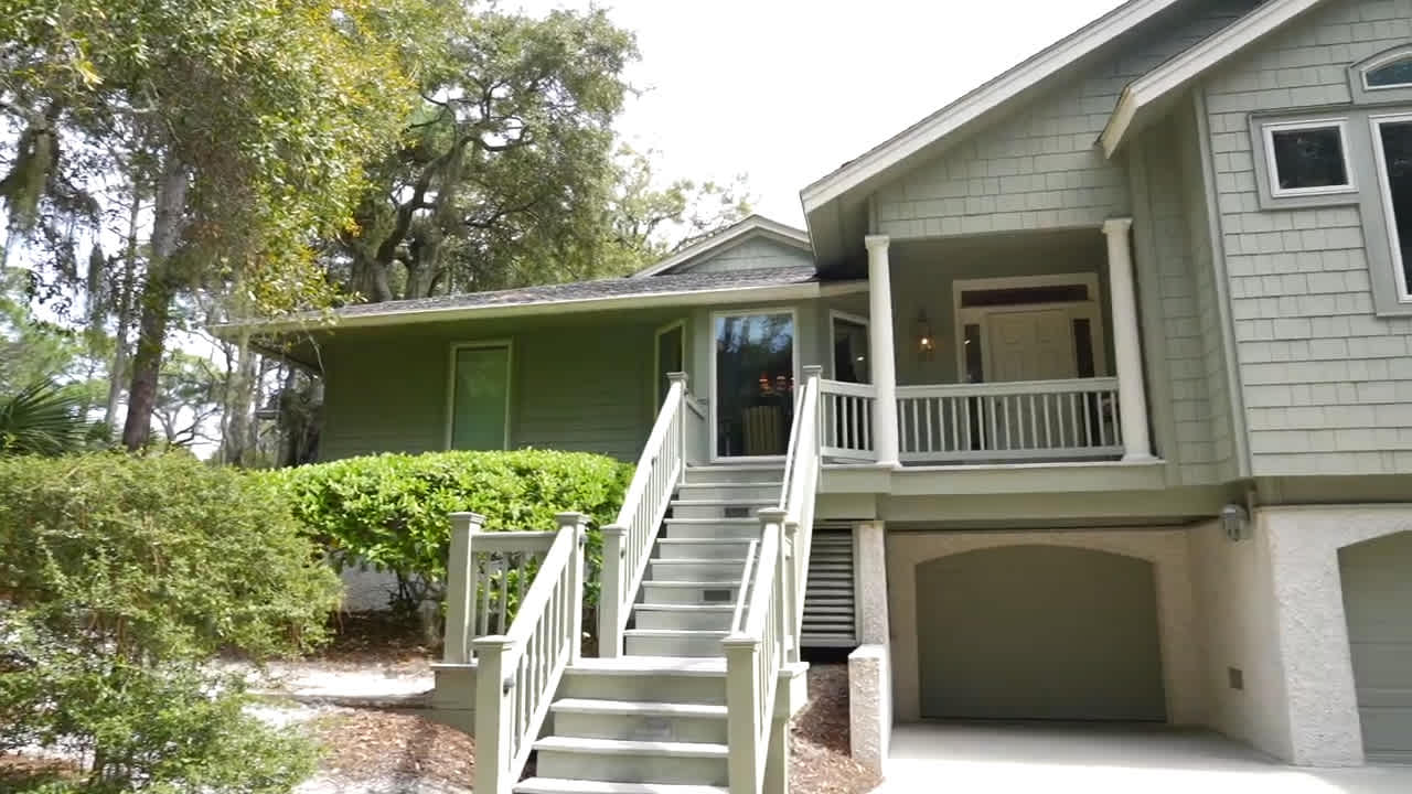 Mary & Chloe tour 45 S. Sea Pines Drive on Sprunt Pond in Sea Pines