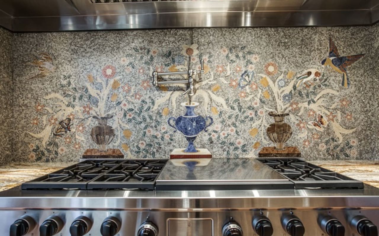 Stunning kitchen backsplash featuring detailed mosaic work that adds visual interest and a touch of elegance.