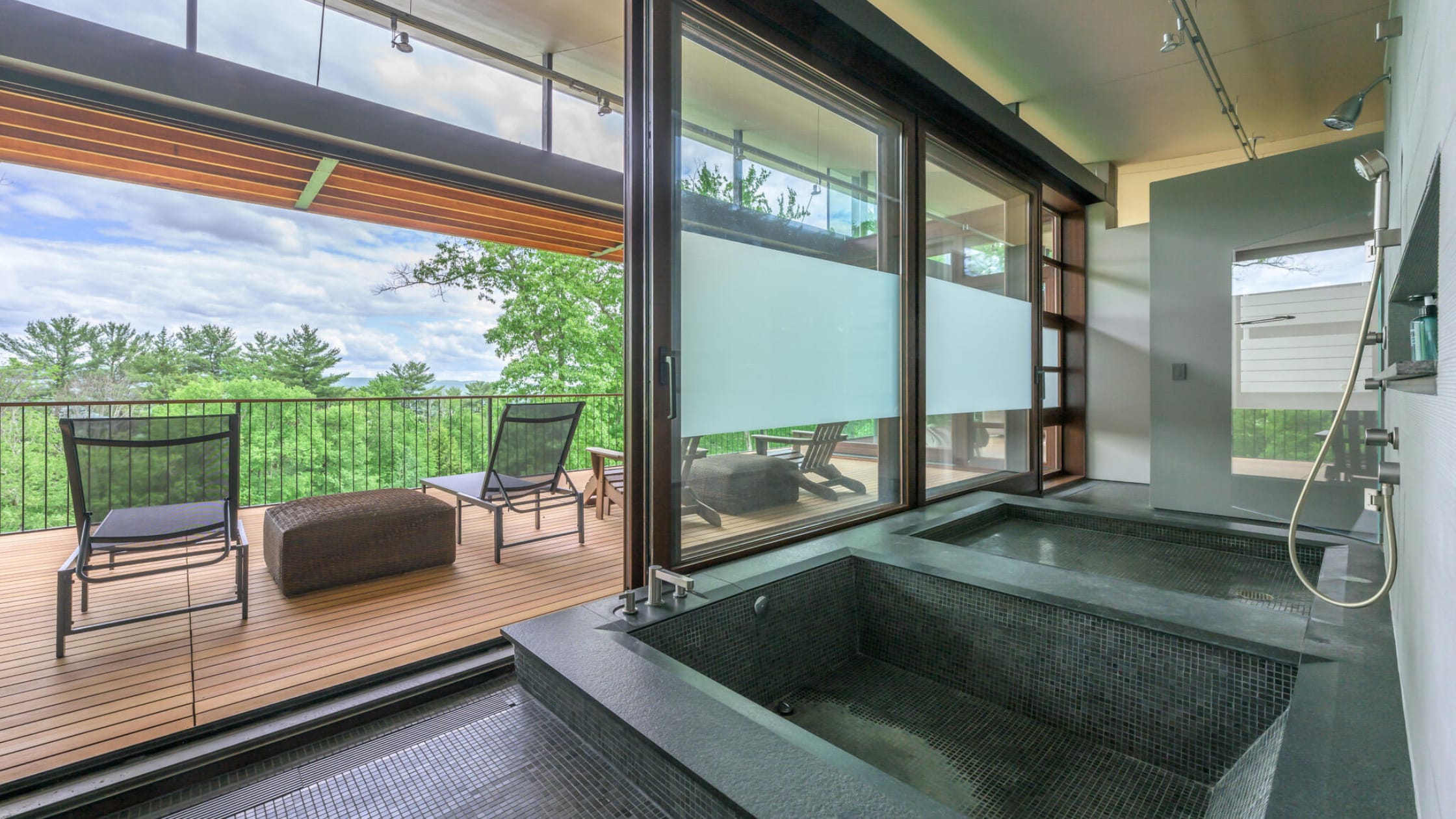 view of the bathroom with soaker tub and stand shower next to it - stone house properties- 250 Long Pond Road
