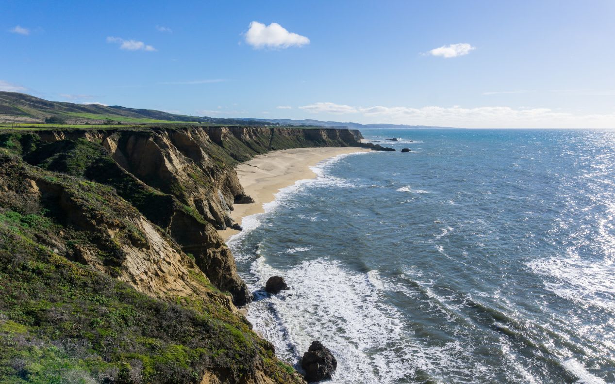 Cliffs and large half moon shaped beach, Pacific Ocean Coast, Half Moon Bay, California
