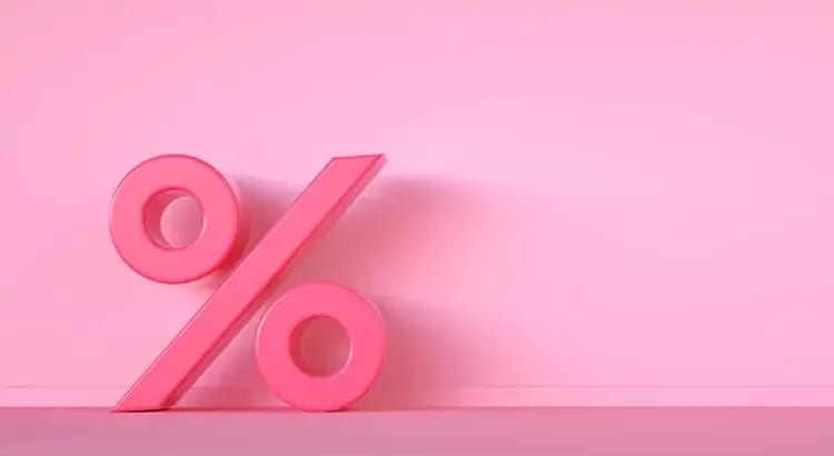 A pink background with a large percentage symbol (%). This image likely represents financial concepts, such as interest rates or discounts.