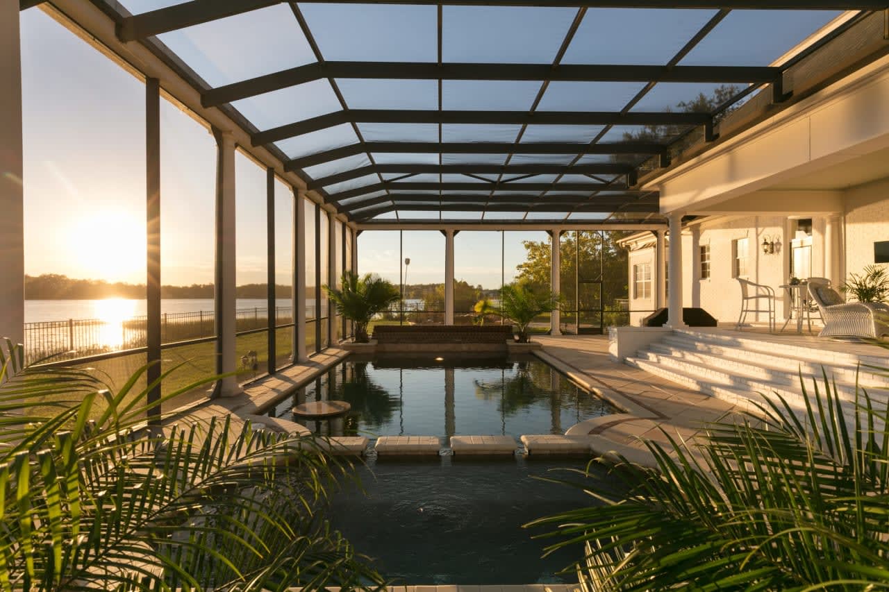 An inviting indoor pool shimmering with tranquility in a luxury home.