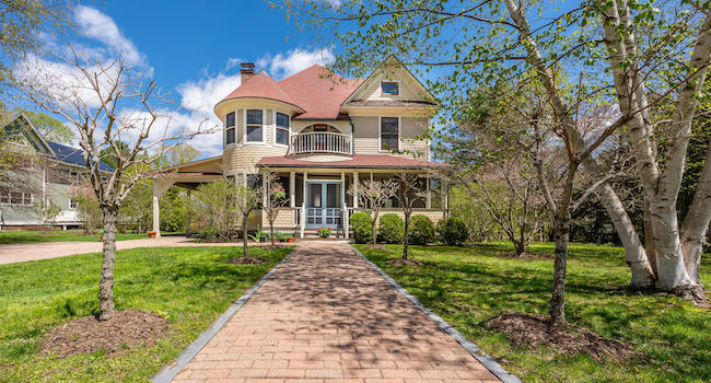An exterior view of Victorian-style home 22 Cliffwood Street in Lenox, MA, listed for sale by Stone House Properties