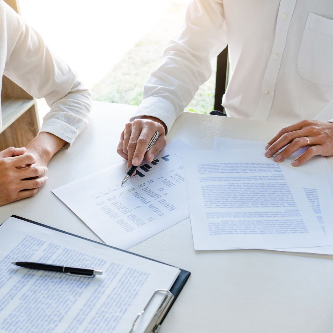 Real estate agent and client going over paperwork