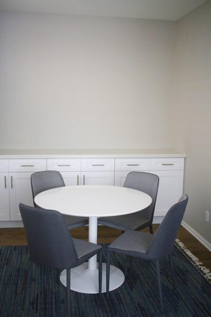 Before breakfast nook with heavy brown cabinets