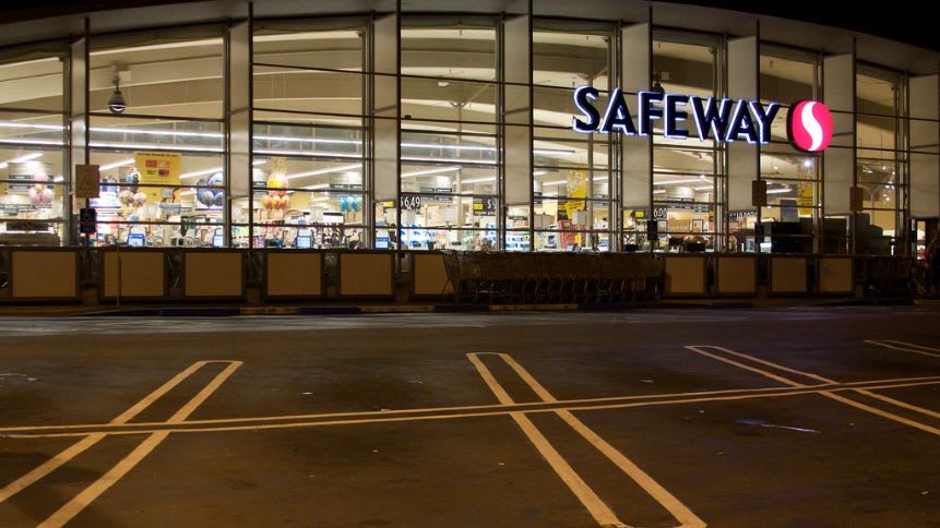 Marina Safeway stands out with its expansive glass facade, offering a clear view into the well-lit interiors. The iconic Safeway sign marks a place of convenience and community.