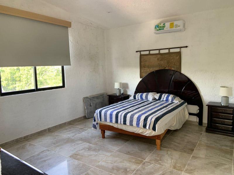 House Can-Can, a captivating residence nestled within the prestigious Cancun Country Club/ Room