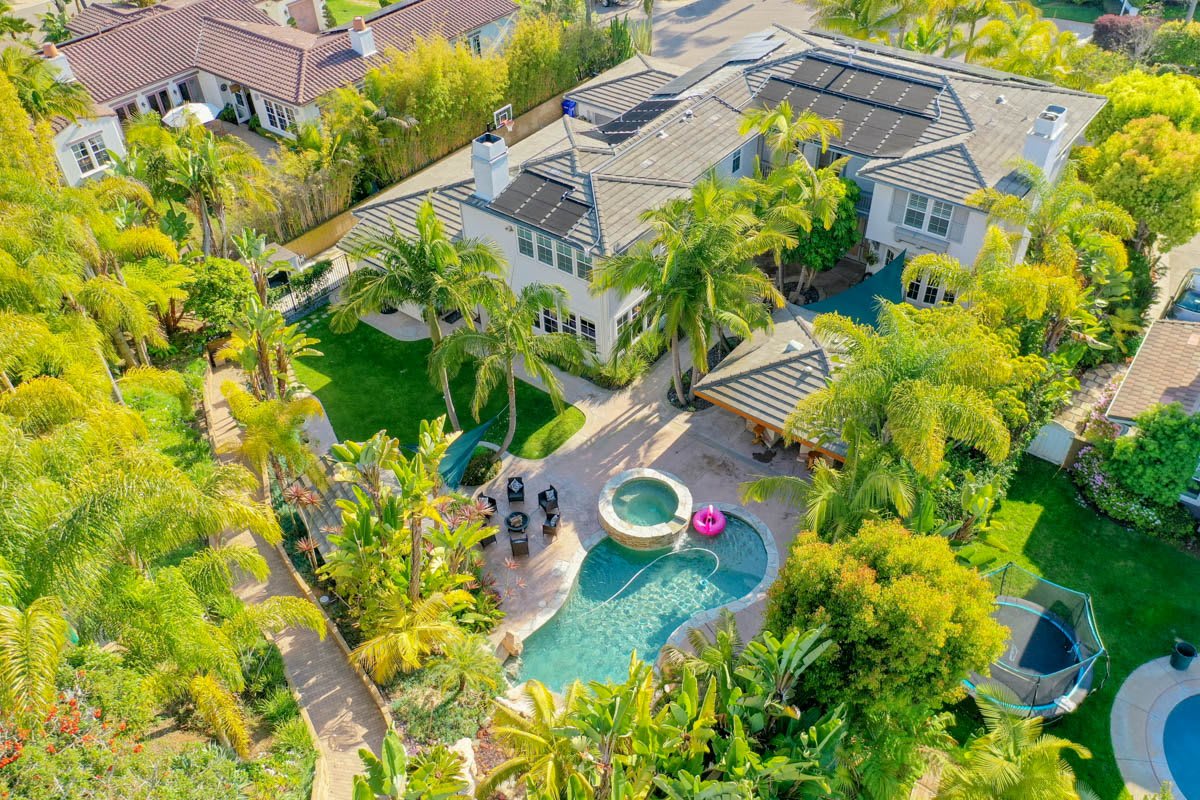 Aerial view of 1337 Skyros Way showing the lush grounds and backyard pool
