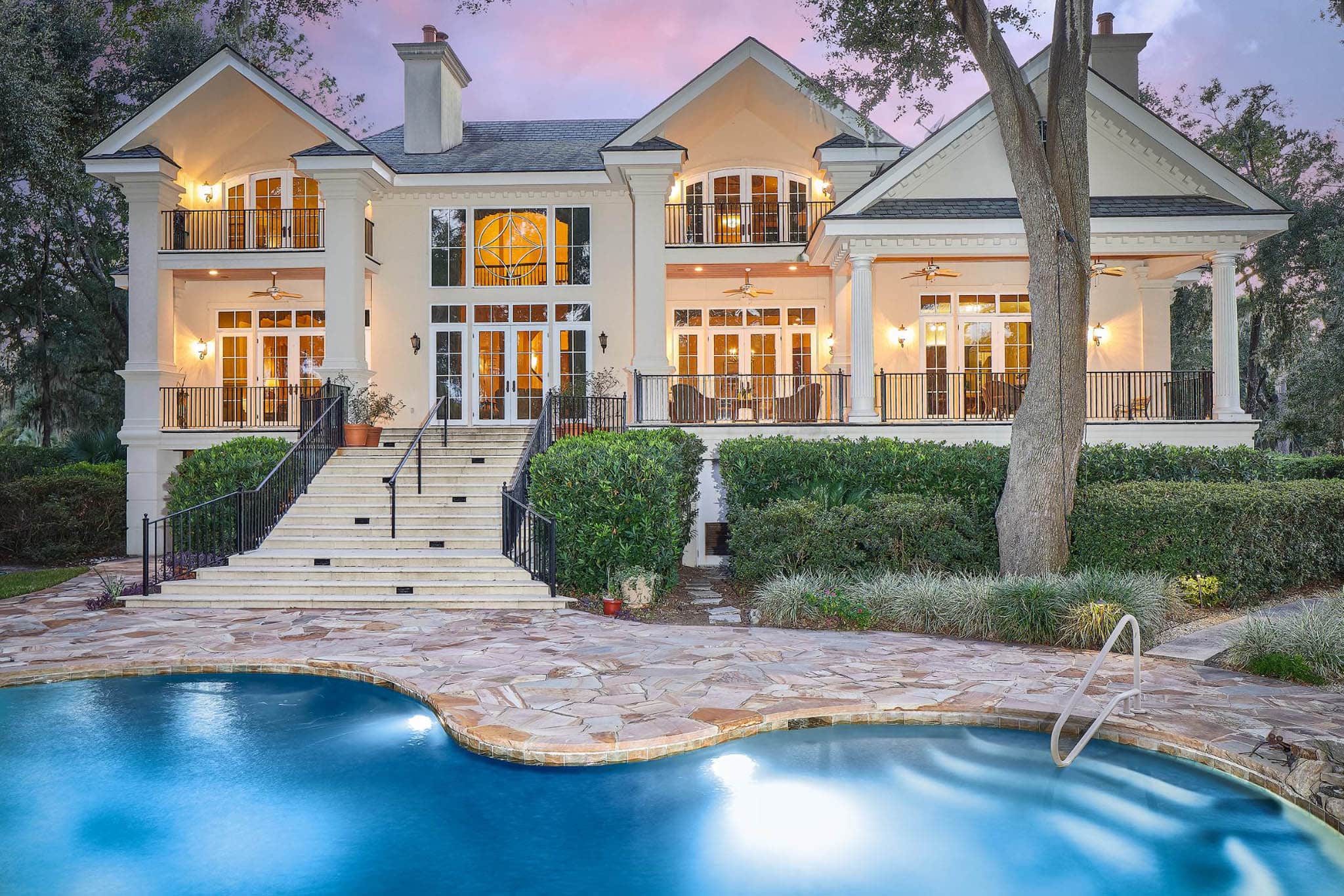 Pool with walkway leading to house