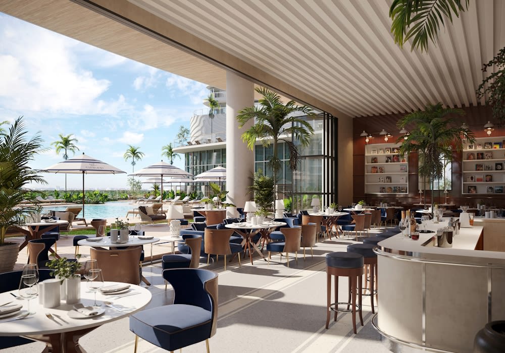 Cipriani Residences restaurant terrace with a curved bar, palm trees, and poolside dining.
