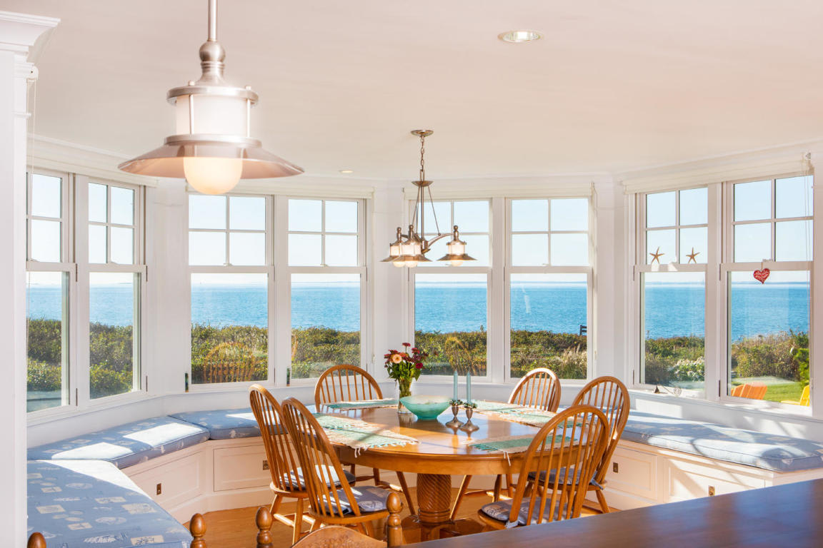 dining room with wooden table and ocean view