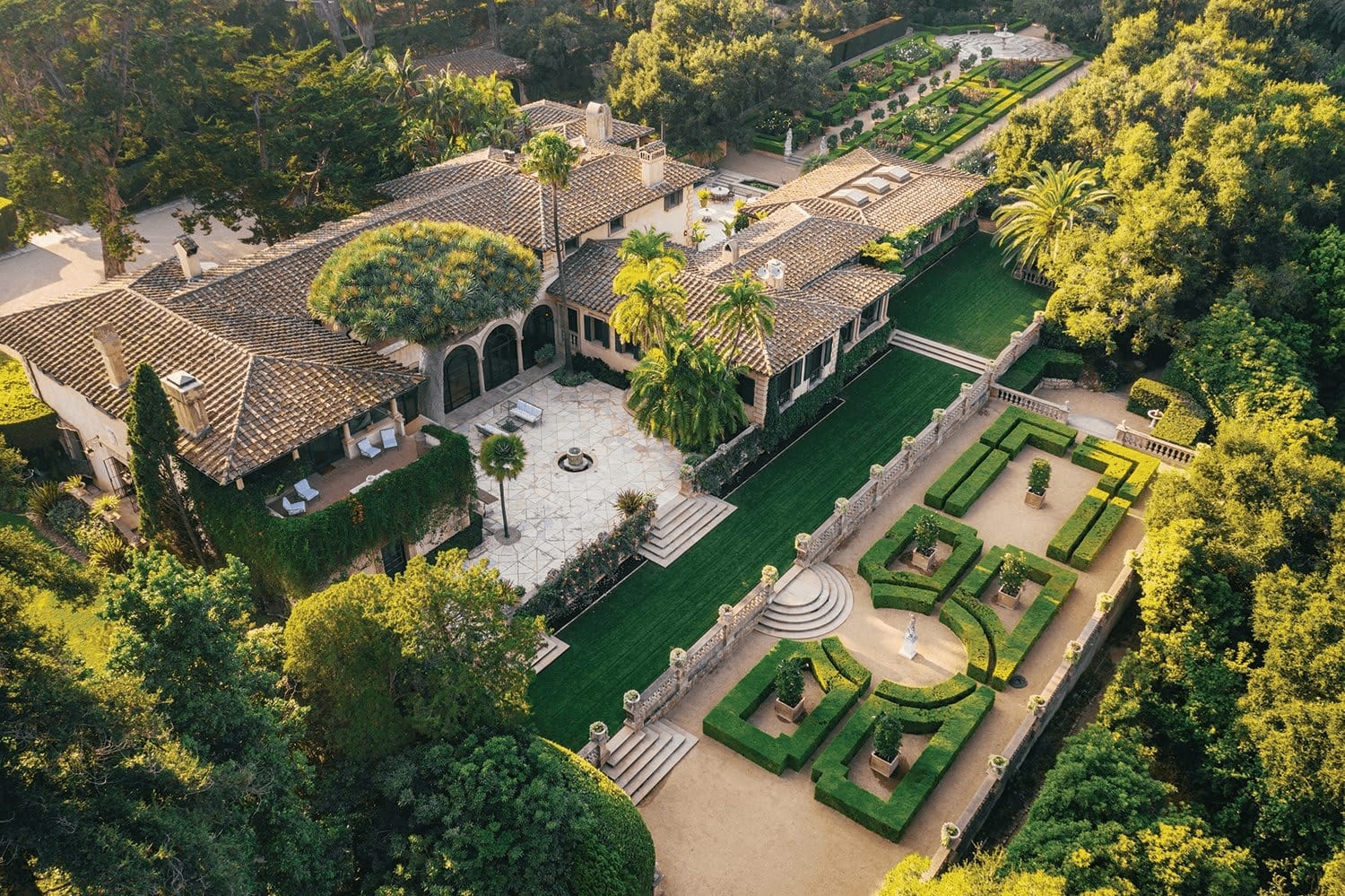 Aerial view of luxury estate with formal gardens
