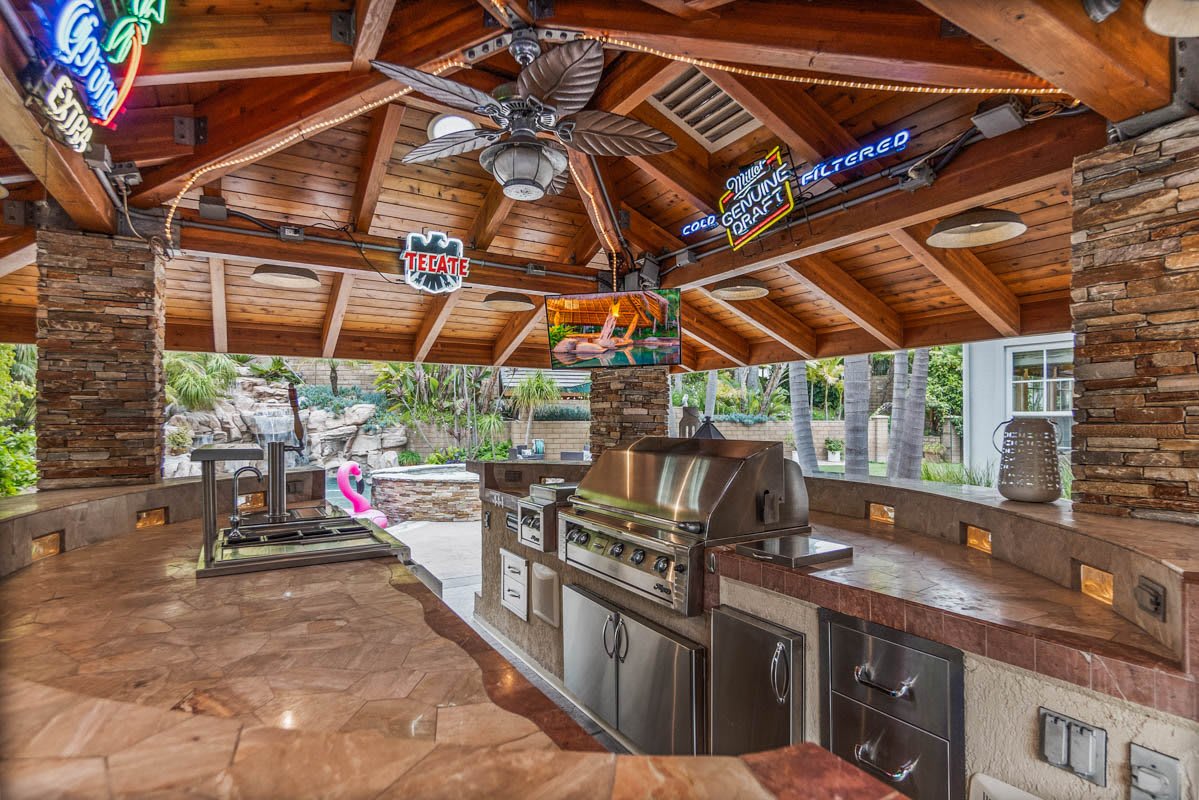 Outdoor covered bar at 1337 Skyros Way with ceiling fan and full kitchen with built-in BBQ
