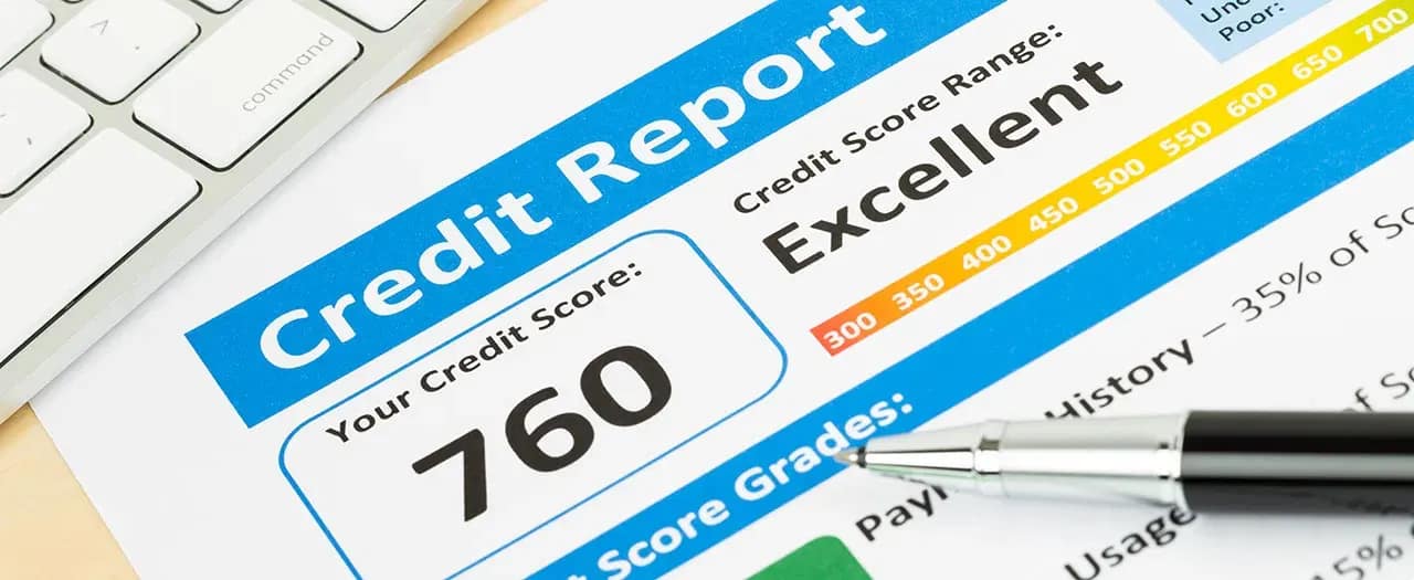 Credit report showing a score of 760 in the excellent range, with a pen across the page.