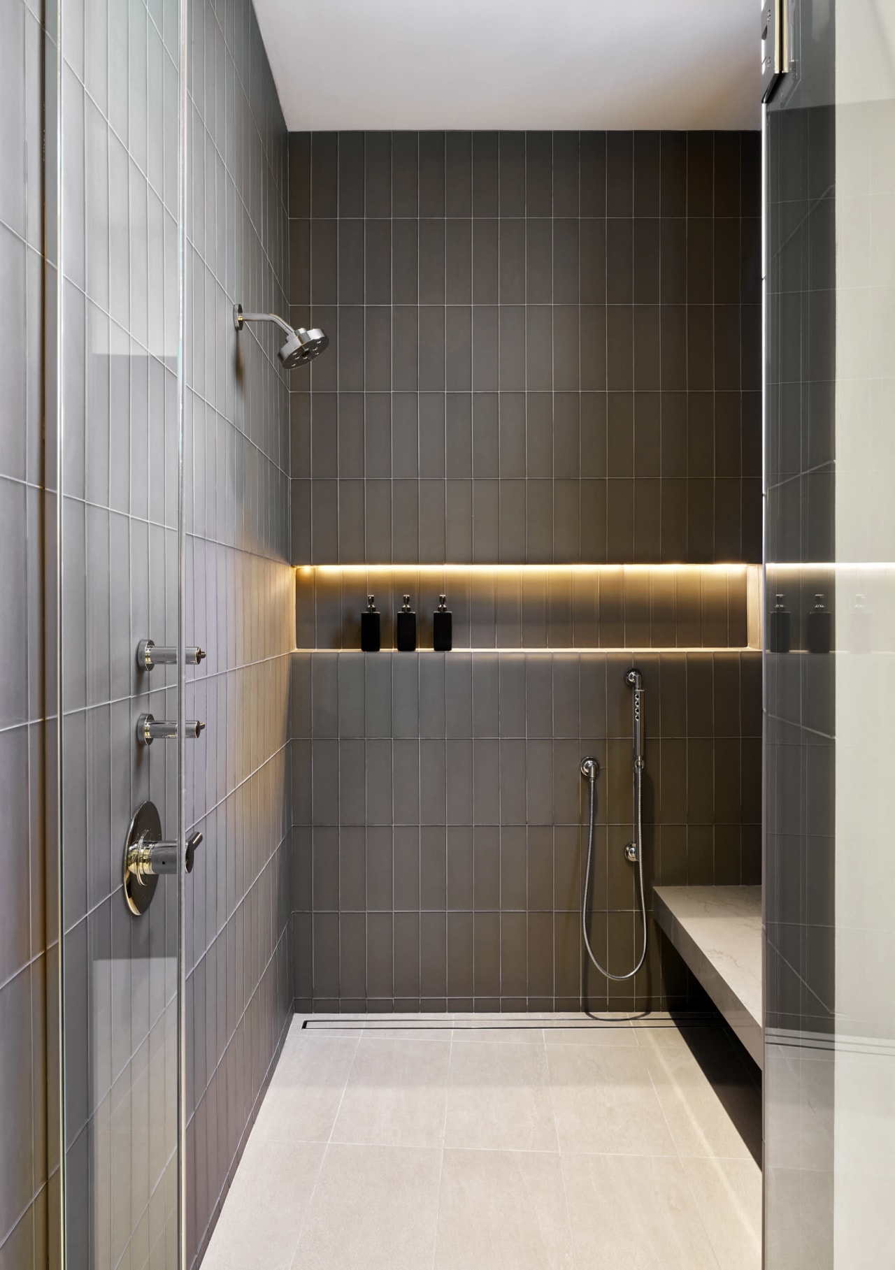 Modern shower with gray stone and tiles