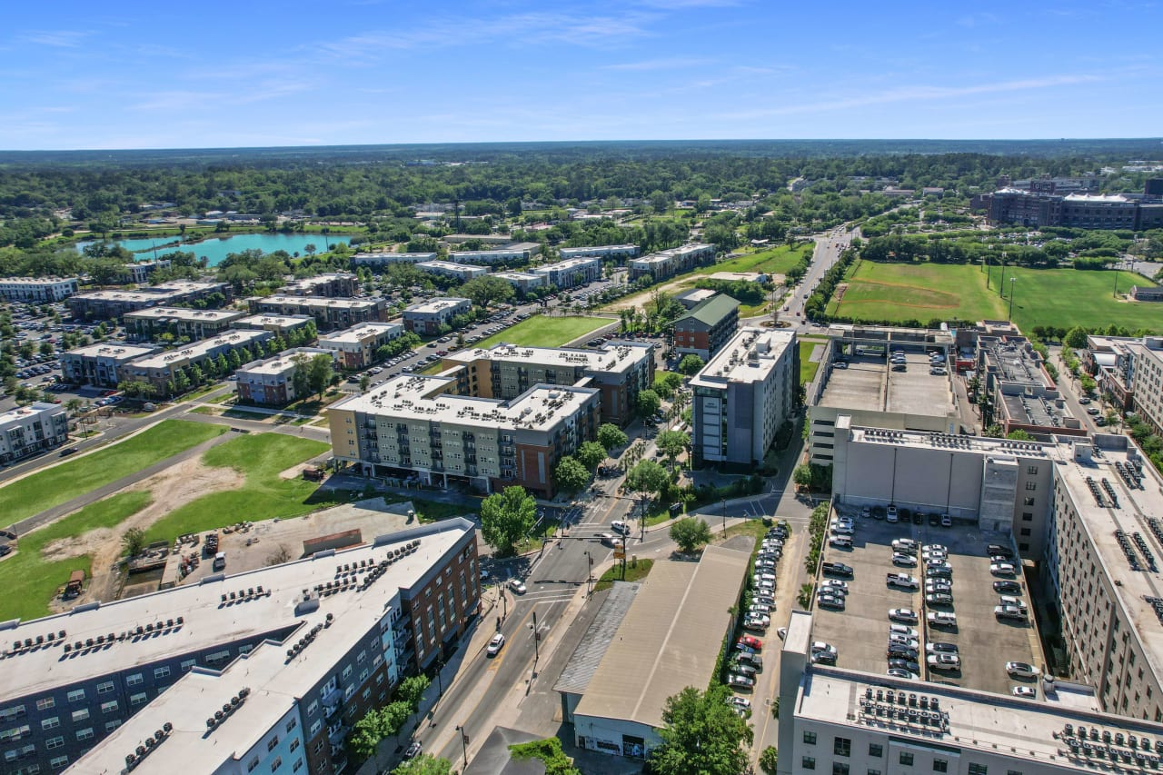 An aerial view of the College Town area, showing a mix of residential and commercial buildings, streets, and green spaces.