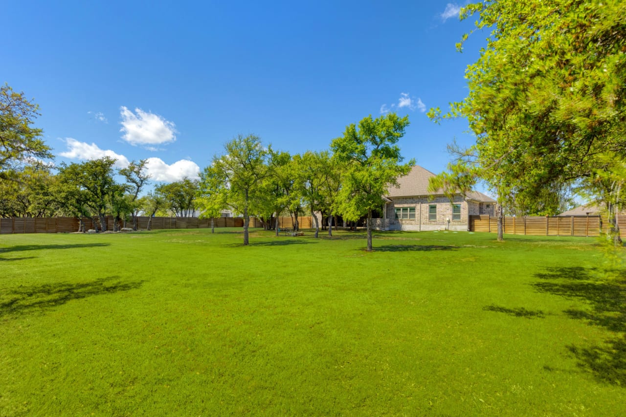 With a backyard adorned with trees and ample space for a pool, this property offers endless opportunities for relaxation and recreation.