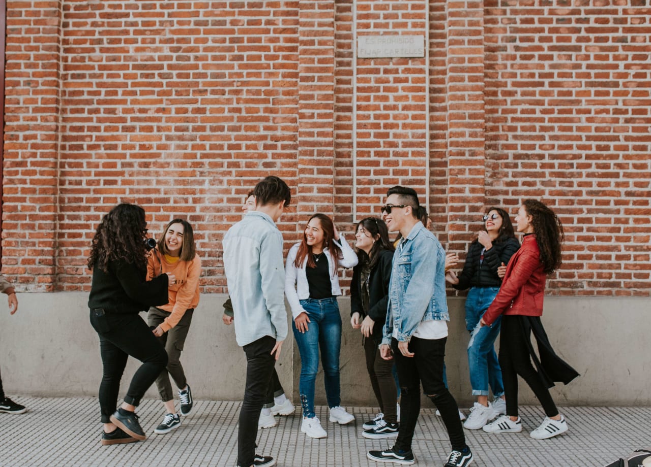 A group of friends laughing with each other.