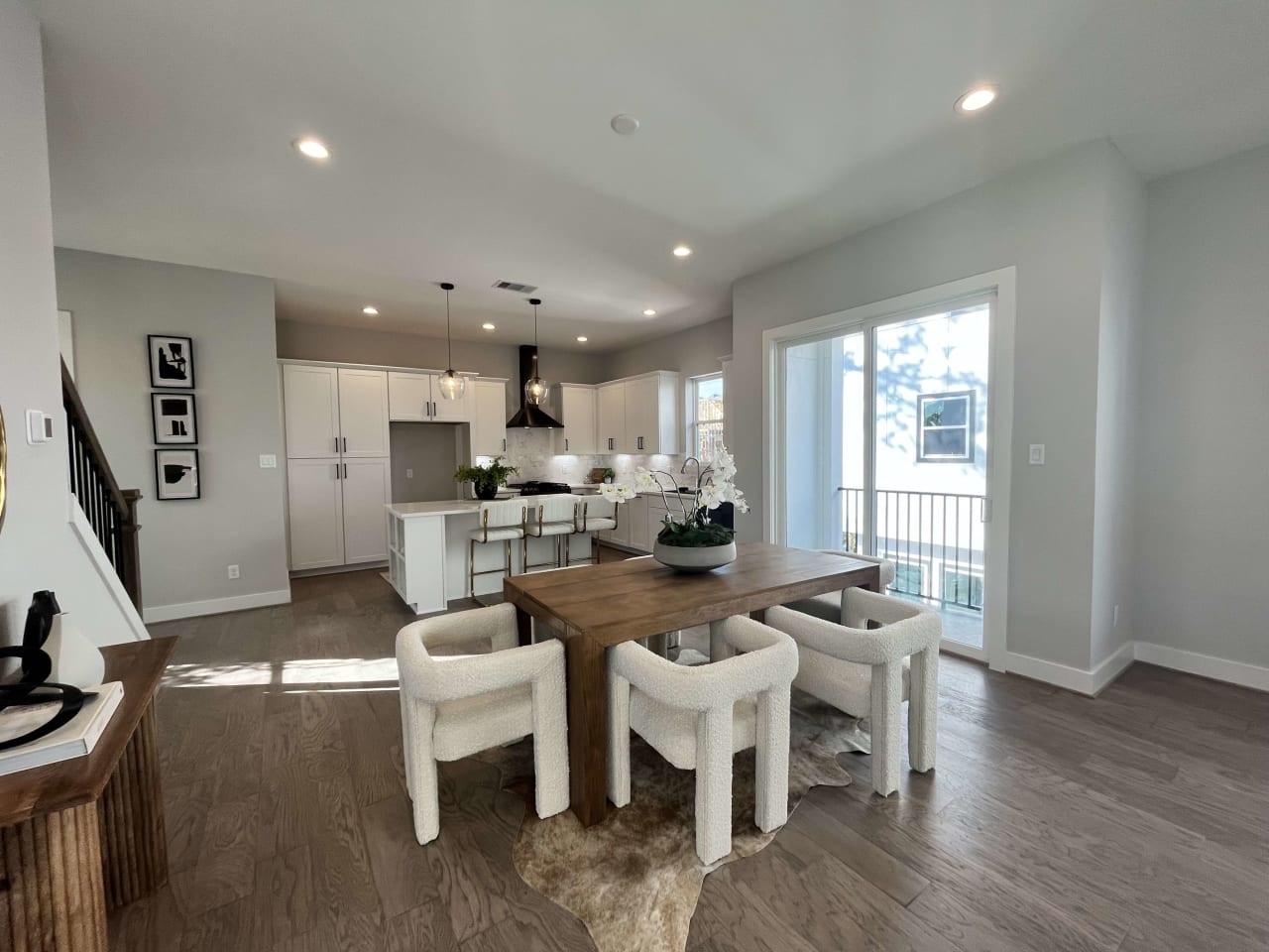 wide shot of a model dining room and kitchen in a new home