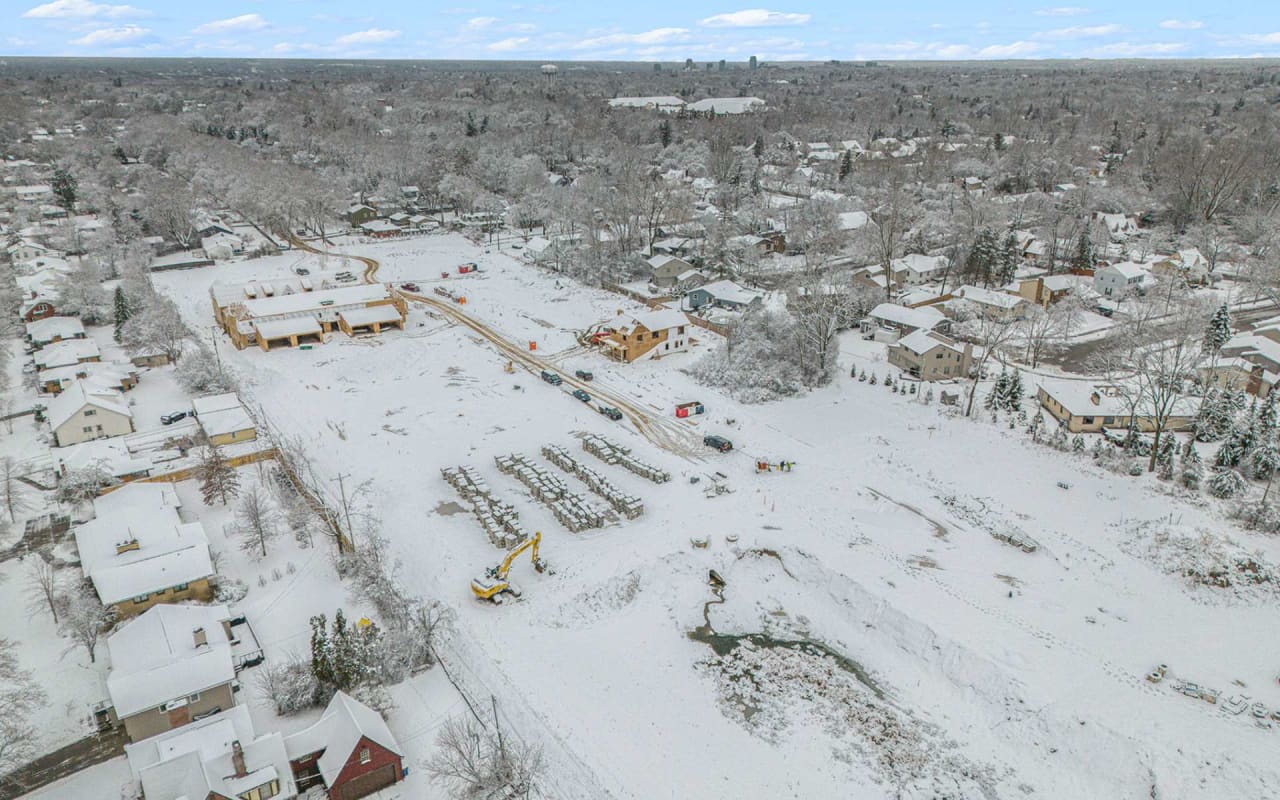 An aerial view of a snow-covered neighborhood.