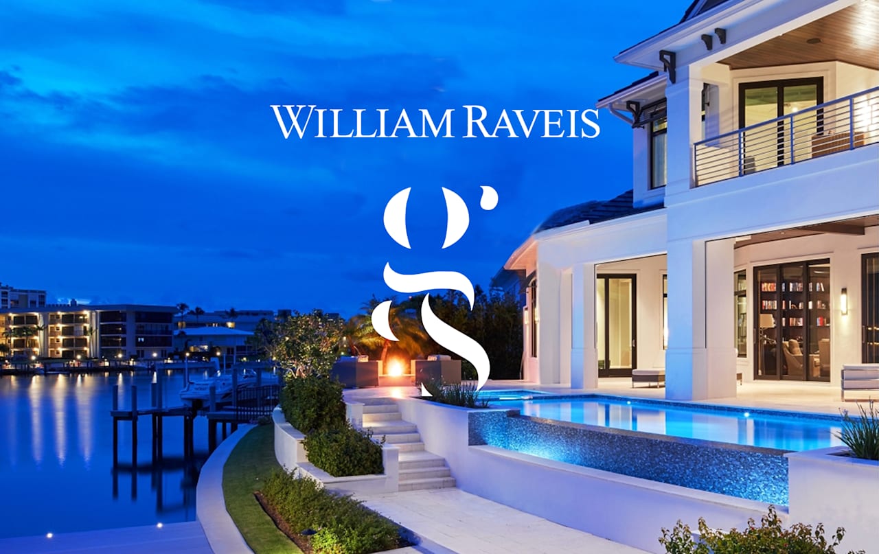 Waterfront home with illuminated pool and private dock at dusk.