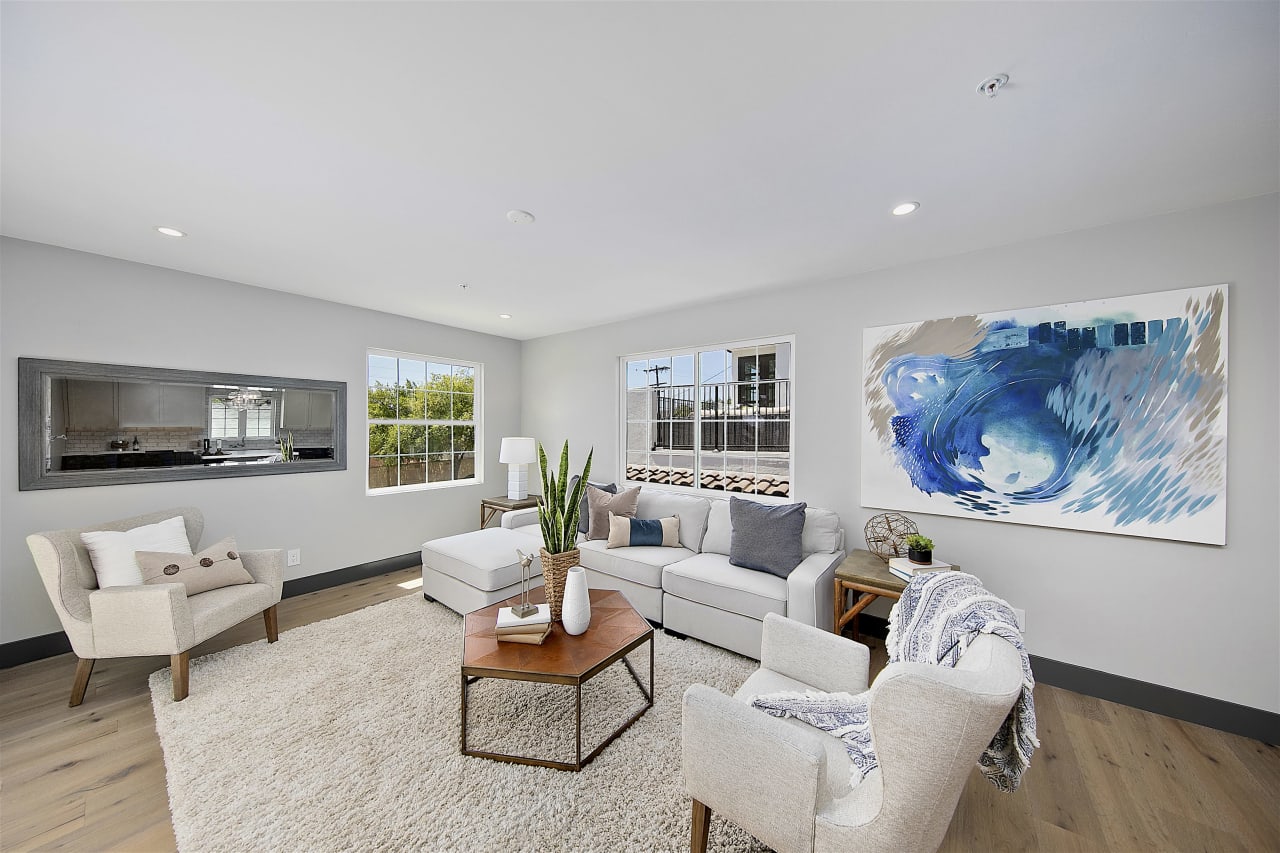 living room with blue art and neutral furniture in pacific beach san diego