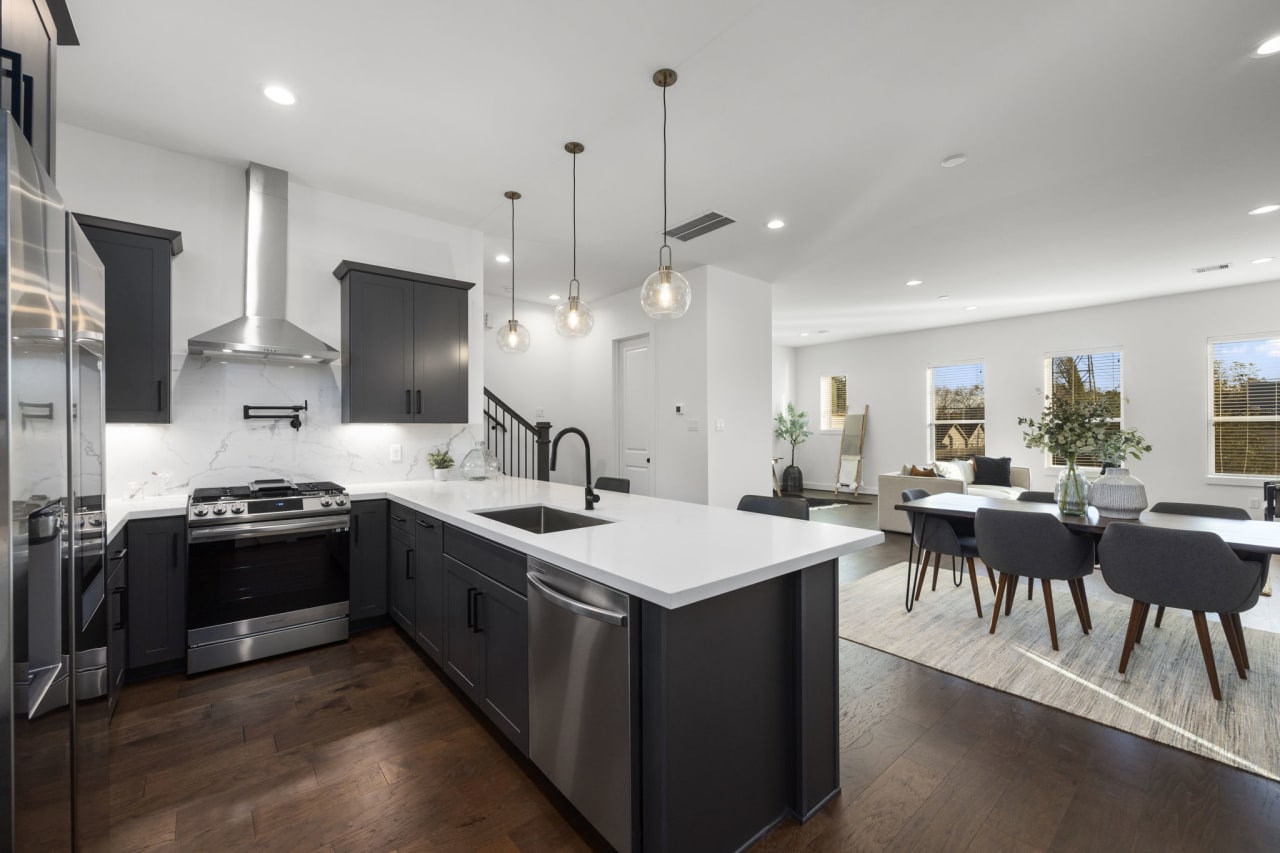 model kitchen with silver appliances in Eastwood Estates